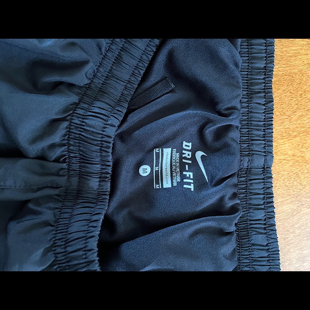Black Nike women’s Dri-Fit running shorts, size medium.